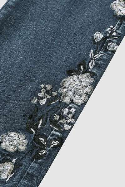 Jean bootcut taille moyenne avec broderie florale à la main