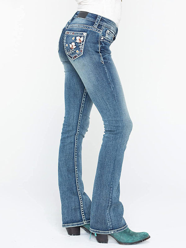 Jeans bootcut elásticos de tiro medio con bordado floral desgastado y lavado