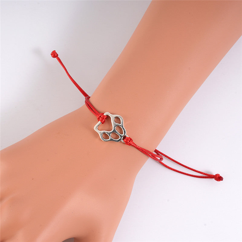 Bracelet ajustable tressé en forme de patte de chien