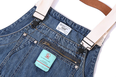 Salopette multi-poches à bretelles en denim vieilli